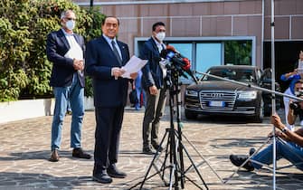 Former Italian prime minister Silvio Berlusconi addresses the media, as he leaves the San Raffaele Hospital in Milan on September 14, 2020 after he tested posititive for coronavirus and was hospitalized since September 3. (Photo by Piero CRUCIATTI / AFP) (Photo by PIERO CRUCIATTI/AFP via Getty Images)