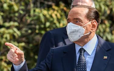 Former Italian prime minister Silvio Berlusconi gestures as he leaves the San Raffaele Hospital in Milan on September 14, 2020 after he tested posititive for coronavirus and was hospitalized since September 3. (Photo by Piero CRUCIATTI / AFP) (Photo by PIERO CRUCIATTI/AFP via Getty Images)