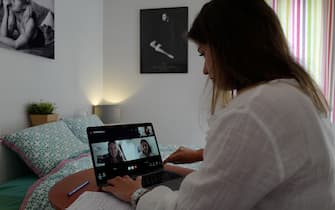 Manon, employee of global PR group Sagarmatha - Hopscotch, connects with her colleagues in Paris via videochat at her home office (teletravail) in the French riviera city of Nice, southern France, on May 15, 2020, a few days after France eased lockdown measures taken to curb the spread of the COVID-19 pandemic, caused by the novel coronavirus. (Photo by VALERY HACHE / AFP) (Photo by VALERY HACHE/AFP via Getty Images)