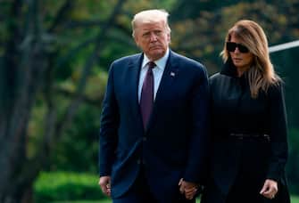 US President Donald Trump and First Lady Melania Trump return to the White House in Washington, DC, on September 11, 2020. - President Trump and the First Lady traveled to  Shanksville, Pennsylvania, to attend the 19th anniversary commemoration for the 9/11 attacks. (Photo by ANDREW CABALLERO-REYNOLDS / AFP) (Photo by ANDREW CABALLERO-REYNOLDS/AFP via Getty Images)