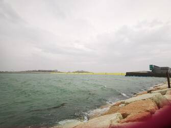 The barriers of the 'Mose', emerged from the water, for the first time, to protect Venice from the high tide, for now still under the metro, Venice, Italy, 03 October 2020. On Venice has begun to rain, and there is a strong sirocco wind.  ANSA / Elisa Fornari