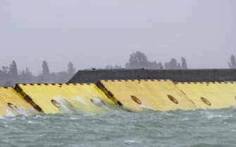 VENICE, ITALY - OCTOBER 03: All the gates of the Mose flood defences are raised completely in the morning to prevent the exceptional high tide on October 03, 2020 in Venice, Italy. Today in Venice an exceptional high tide of 130 cm was recorded, and the Mose flood defenses barriers were put into action for the first time in history.  (Photo by Simone Padovani/Awakening/Getty Images)