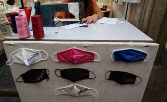 A seamstress sews custom name face masks at a shop at Piazza di Pietra in downtown Rome on September 25, 2020 during the COVID-19 pandemic, caused by the novel coronavirus. - Italy, which was hit hard by the first wave of the coronavirus, is today an exception in Europe with a limited number of new cases, a result obtained at the price of strict anti-COVID measures, hailed on September 25, 2020 by the World Health Organization (WHO). (Photo by Vincenzo PINTO / AFP) (Photo by VINCENZO PINTO/AFP via Getty Images)