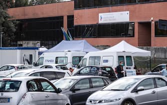 Motorists wait in line for their swab samples to be taken for COVID-19 testing by health workers at the drive-in of the 'Casa della Salute' of the ASL Roma 1 health facilities in the Labaro district, Rome, Italy, 7 October 2020. ANSA/GIUSEPPE LAMI