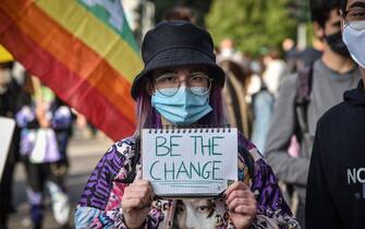 Supporters of school strike movement Fridays For Future demonstrate during the global climate action day in Castello square in Milan, Italy,  09 October 2020  Ansa/Matteo Corner