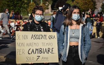 Supporters of school strike movement Fridays For Future demonstrate during the global climate action day in Castello square in Milan, Italy,  09 October 2020  Ansa/Matteo Corner