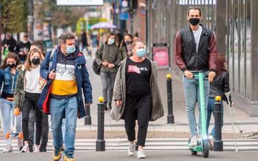People wearing protective masks are seen on the streets of Warsaw after the Polish government tightened restrictions in the fight against the coronavirus and introduced mandatory mouth and nose coverage in public places, on October 10, 2020. - Polish senior citizens will once again be able to do their shopping without contact with the rest of the population, with shops reserved for them for two hours each day, the Polish Prime Minister announced on Saturday following record increases in contamination. (Photo by Wojtek RADWANSKI / AFP) (Photo by WOJTEK RADWANSKI/AFP via Getty Images)