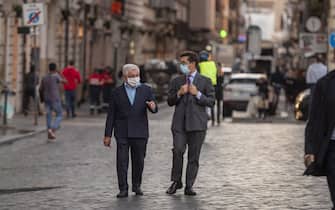 ROME, ITALY - OCTOBER 07: People wearing protective masks walk at Via Condotti amid Covid-19 pandemic, on October 07, 2020 in Rome, Italy. Today Italian Prime Minister Giuseppe Conte set an order to make the wearing of face masks in outdoor spaces mandatory due to the increase of Covid-19 cases in Italy. Today there has been an increase in new COVID-19 cases in Italy with the number rising to 3678 for the first time in months. (Photo by Antonio Masiello/Getty Images)