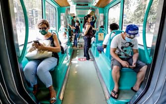 Passengers wearing face masks travel with the tram in Milan, northern Italy, during phase 3 of the Covid-19 emergency, 01 August 2020.
ANSA/ MOURAD BALTI TOUATI