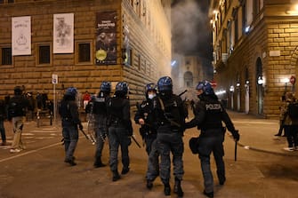 A moment of clashes between Italian Police and protesters in Signoria square during an unauthorized demonstration convened on social networks to protest the government decree in force to face the second wave of the Coronavirus Covid-19 epidemic, Florence, Italy, 30 October 2020. The demonstration is attended by people of various political backgrounds, ranging from the right to antagonism.  ANSA / CLAUDIO GIOVANNINI