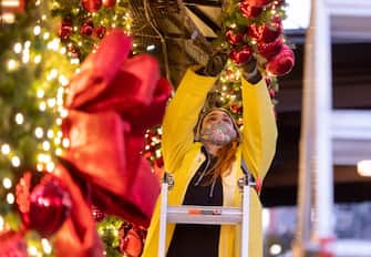 NEW YORK, NEW YORK - NOVEMBER 23: A person decorates outside Macy's in Herald Square on November 23, 2020 in New York City. Many holiday events have been canceled or adjusted with additional safety measures due to the ongoing coronavirus (COVID-19) pandemic. (Photo by Noam Galai/Getty Images)
