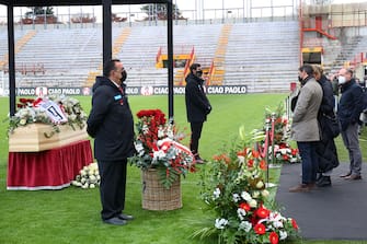 Paolo Rossi's son, Alessandro, says a final farewell to the former Italian football player, as his coffin is on public display in the  Romeo Menti  stadium in Vicenza, Northeastern Italy, on December 11, 2020. - Paolo Rossi, who fired Italy to victory in the 1982 World Cup after almost missing the tournament through a match-fixing scandal, has died aged 64, prompting an outpouring of grief and tributes. ANSA/NICOLA FOSSELLA