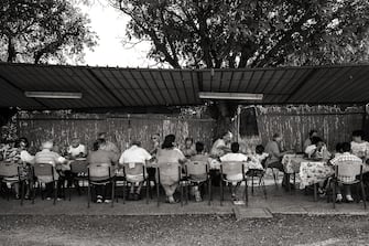 Lunch in a  Family Group .
-
Grosseto (Tuscany) - Italy - 8 July 2017.
-
Today, around 300 people live in Nomadelfia divided into eleven groups. Every group is made up of four or five families, making a total of around 30 people who live in each of the 11 groups around the estate. 