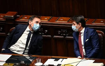 Italian Prime Minister Giuseppe Conte (R), pictured with Minister of Regional Affairs Francesco Boccia (L), delivers a speech at the Chamber of Deputies on the upcoming European Council meeting, Rome, Italy, 9 December 2020. ANSA/RICCARDO ANTIMIANI