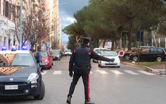 Un posto di controllo dei Carabinieri in via Appia Nuova per la Zona Rossa in occasione delle festivit  natalizie. Roma, 24 dicembre 2020. ANSA/CLAUDIO PERI