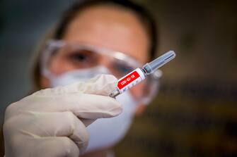 A nurse shows a COVID-19 vaccine produced by Chinese company Sinovac Biotech at the Sao Lucas Hospital, in Porto Alegre, southern Brazil on August 08, 2020. - The vaccine trial is being carried out in Brazil in partnership with Brazilian Research Institute Butanta. (Photo by SILVIO AVILA / AFP) (Photo by SILVIO AVILA/AFP via Getty Images)