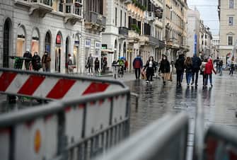 Few people for the city due to the rain in via del Corso in Rome, Italy, February 7, 2021. There were no criticalities due to the gatherings due to bad weather. ANSA/RICCARDO ANTIMIANI