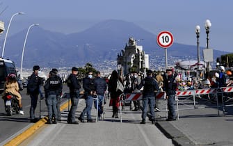 The barriers placed by law enforcement officers on the sidewalk in via Caracciolo to stem the gathering of pedestrians who, thanks to the beautiful sunny day, have crowded the seaside since the morning, in Naples, southern Italy, 20 February 2021. ANSA/CIRO FUSCO