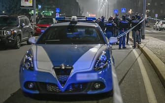 Police and forensics officers at the site where a man who attacked passers-by on the street, armed with a large knife, was killed by the agents who intervened in Milan, Italy, February 23, 2021.
ANSA / Andrea Fasani