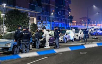 Police and forensics officers at the site where a man who attacked passers-by on the street, armed with a large knife, was killed by the agents who intervened in Milan, Italy, February 23, 2021.
ANSA / Andrea Fasani