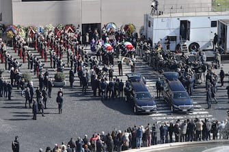 Honor guards carry the coffins of Italian ambassador Luca Attanasio and carabiniere Vittorio Iacovacci at the end of the funeral in the church of Santa Maria degli Angeli in Rome, Italy, 25 February 2021. Italian ambassador in the Congo, Luca Attanasio, and carabiniere Vittorio Iacovacci were killed in an attack in Congo on the road between Goma and Rutshuru.  ANSA/ALESSANDRO DI MEO