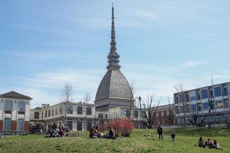 People walking around the Royal Gardens take advantage of the beautiful day and the last weekend before the passage from Monday 15 March of Piedmont to the red zone, Turin, Italy, 13 March 2021 ANSA / JESSICA PASQUALON