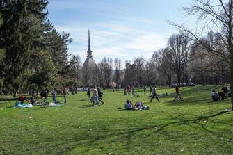 People walking around the Royal Gardens take advantage of the beautiful day and the last weekend before the passage from Monday 15 March of Piedmont to the red zone, Turin, Italy, 13 March 2021 ANSA / JESSICA PASQUALON