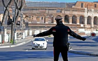 Italian Carabinieri carry out checks during the coronavirus emergency close to  Colosseum, Rome, Italy, 15 March 2021. New restrictions came into effect from midnight 15 March as most of Italy will be a red zone in Italy's tier system due to a sharp rise in numbers of infections with the Sars-Cov-2 coronavirus that causes the Covid-19 disease. ANSA/ETTORE FERRARI
