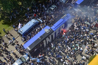 Inter supporters celebrate the victory of the Italian Championship in front of the Giuseppe Meazza stadium before the Serie A soccer match between FC Inter Milan and Udinese in Milan, Italy, 23 May 2021.  ANSA/ANDREA FASANI