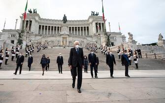 epa09242559 A handout photo made available by the Chigi Palace Press Office shows Italian President Sergio Mattarella (C) as he attends the wreath-laying ceremony at the Altar of the Fatherland as part of celebrations marking the 75th Republic Day, in Rome, Italy, 02 June 2021. The anniversary marks the proclamation of the Italian Republic in 1946.  EPA/FILIPPO ATTILI/ CHIGI PALACE/ HANDOUT  HANDOUT EDITORIAL USE ONLY/NO SALES