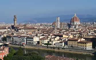 A picture taken on September 14, 2020 shows the Palazzo Vecchio (L), the Giotto bell tower or the Bell tower, the Santa Maria del Fiore Cathedral or Duomo (R) and the Arno river (down) in the center of Florence. (Photo by MIGUEL MEDINA / AFP) (Photo by MIGUEL MEDINA/AFP via Getty Images)