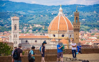 480034092 FLORENCE, ITALY - JUNE 16: Tourists and traveler visit the sightseeing point Fort Belvedere with a panoramic view on Basilica Santa Maria Novella on June 16, 2015 in Florence, Italy. (Photo by EyesWideOpen/Getty Images)