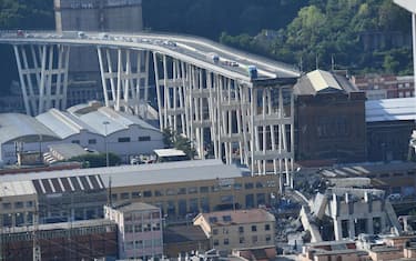A general view showing the collapsed section after a highway bridge collapsed in Genoa, Italy, 14 August 2018. A large section of the Morandi viaduct upon which the A10 motorway runs collapsed in Genoa on early 14 August. Several people have died, rescue sources said, as both sides of the highway fell. The viaduct gave way amid torrential rain.   ANSA/LUCA ZENNARO