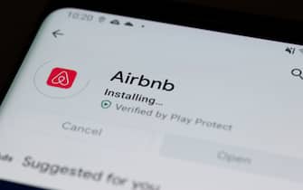 An Airbnb logo is seen on a mobile device in this photo illustration in Mountain View, California, United States on December 10, 2020. The vacation rental app company has listed on Nasdaq in the middle of the coronavirus (COVID-19) pandemic, which has profoundly impacted the travel industry in 2020. (Photo by Yichuan Cao/Sipa USA)