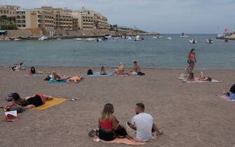 PACEVILLE, MALTA - JUNE 01: Spaced out, beach-goers sunbathe at St.George's Bay on June 1, 2021 in Paceville, Malta. From June 1, Malta will reopen its doors to tourism, allowing passengers holding vaccine certificates or those who can present a negative coronavirus test before traveling to the Mediterranean island. Nearly 70 per cent of Malta's adults have received one vaccine dose, yet the virus is still circulating on the island, with some 42 per cent of the population fully inoculated against Covid-19.  (Photo by Joanna Demarco/Getty Images), MALTA - JUNE 01: <<enter caption here>> on June 1, 2021 in UNSPECIFIED, Malta. From June 1, Malta will reopen its doors to tourism, allowing passengers holding vaccine certificates or those who can present a negative coronavirus test before traveling to the Mediterranean island. Nearly 70 per cent of Malta's adults have received one vaccine dose, yet the virus is still circulating on the island, with some 42 per cent of the population fully inoculated against Covid-19.  (Photo by Joanna Demarco/Getty Images), MALTA - JUNE 01: <<enter caption here>> on June 1, 2021 in UNSPECIFIED, Malta. From June 1, Malta will reopen its doors to tourism, allowing passengers holding vaccine certificates or those who can present a negative coronavirus test before traveling to the Mediterranean island. Nearly 70 per cent of Malta's adults have received one vaccine dose, yet the virus is still circulating on the island, with some 42 per cent of the population fully inoculated against Covid-19.  (Photo by Joanna Demarco/Getty Images)