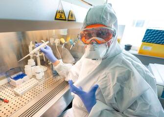 Molecular biologist William Dundon runs a test to detect whether a person has been infected with COVID-19, at the IAEA's Laboratories in Seibersdorf, Austria, on May 7, 2020. - Shortages of materials needed in tests for the novel coronavirus continue to be "critical", according to the head of a UN lab, which is supplying countries with COVID-19 detection tests. (Photo by JOE KLAMAR / AFP) / The erroneous mention[s] appearing in the metadata of this photo by JOE KLAMAR has been modified in AFP systems in the following manner: [Molecular biologist William Dundon] instead of [Giovanni Cattoli, head of the joint FAO/IAEA Animal Production and Health Laboratory]. Please immediately remove the erroneous mention[s] from all your online services and delete it (them) from your servers. If you have been authorized by AFP to distribute it (them) to third parties, please ensure that the same actions are carried out by them. Failure to promptly comply with these instructions will entail liability on your part for any continued or post notification usage. Therefore we thank you very much for all your attention and prompt action. We are sorry for the inconvenience this notification may cause and remain at your disposal for any further information you may require. (Photo by JOE KLAMAR/AFP via Getty Images)
