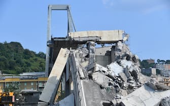 A general view showing a part of the partially collapsed Morandi bridge, in Genoa, Italy, 19 August 2018. Italian authorities, worried about the stability of remaining large sections of the bridge, evacuated about 630 people from nearby apartments. ANSA/LUCA ZENNARO