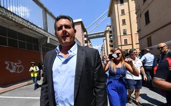 ponte morandi genova crollo ricostruzione Il presidente della Regione Liguria Giovanni Toti durante la visita al centro sfollati di Buranello dove si dà assistenza a chi non può rientrare in casa nella zona rossa del ponte Morandi, Genova, 17 agosto 2018. ANSA/LUCA ZENNARO