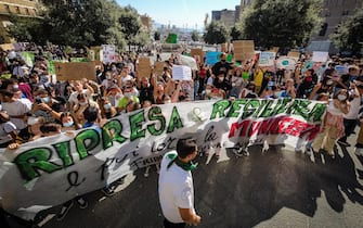 Protesters with signs and slogans during the demonstration Fridays for Future for the global climate strike in naples, Italy, 24 September? 2021. ANSA/CESARE ABBATE