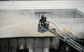 Firefighters work in the building on which a small private plane crashed into the San Donato Milanese district in Milan, Italy, 03 October 2021. A small private plane crashed into a building in via Marignano, in San Donato Milanese ( Milan). Firefighters, police and emergency vehicles have just arrived on the scene. The plane, some cars and the building are on fire. In the end, 6 people died, rescuers said.
ANSA/ANDREA FASANI