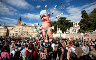 Protesters attend during a protest against the Green Pass in Popolo square, Rome, Italy, 09 October 2021.  ANSA/MASSIMO PERCOSSI