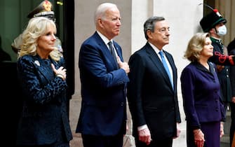 Italy's Prime Minister, Mario Draghi (2ndR) and his wife Maria Serenella Cappello (R) greet greet US President Joe Biden  and US First Lady Jill Biden upon their arrival for their meeting at the Chigi palace in Rome on October 29, 2021, ahead of an upcoming G20 summit of world leaders to discuss climate change, covid-19 and the post-pandemic global recovery. (Photo by Alberto PIZZOLI / AFP) (Photo by ALBERTO PIZZOLI/AFP via Getty Images)