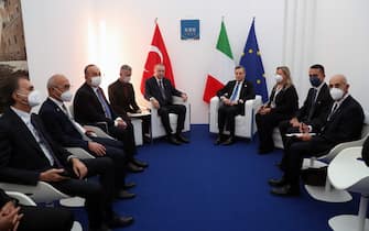 ROME, ITALY - OCTOBER 30: (----EDITORIAL USE ONLY â MANDATORY CREDIT - "TURKISH PRESIDENCY / MURAT CETINMUHURDAR / HANDOUT" - NO MARKETING NO ADVERTISING CAMPAIGNS - DISTRIBUTED AS A SERVICE TO CLIENTS----) Turkish President Recep Tayyip Erdogan (5th L) meets with Italian Prime Minister Mario Draghi (4th R) within the G20 Leaders' Summit in Rome, Italy on October 30, 2021. Turkish Foreign Minister Mevlut Cavusoglu (3rd L) and Turkish Treasury and Finance Minister Lutfi Elvan also attended the meeting. (Photo by Turkish Presidency/ Murat Cetinmuhurdar/Handout/Anadolu Agency via Getty Images)