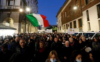 People take part in the 'No Green Pass' rally in Milan, Italy, 06 November 2021. The obligation to have the Green Pass vaccine passport to enter all Italian public and private workplaces came into force last 15 October. ANSA/ MOURAD BALTI TOUATI
