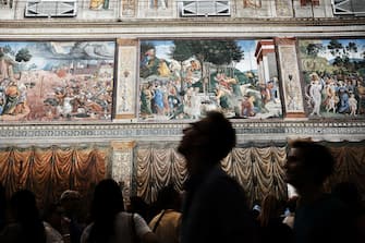 VATICAN CITY, VATICAN - SEPTEMBER 01:  People walk through the Sistine Chapel at the Vatican Museums on September 01, 2018 in Vatican City, Vatican. Tensions in the Vatican are high following accusations that Pope Francis covered up for an American ex-cardinal accused of sexual misconduct. Archbishop Carlo Maria Vigano, a member of the conservative movement in the church, made the allegations and has called for Pope Francis to resign. Many Vatican insiders see the dispute as an outgrowth of the growing tension between the left leaning Pope and the more conservative and anti-homosexual faction of the Catholic Church.  (Photo by Spencer Platt/Getty Images)