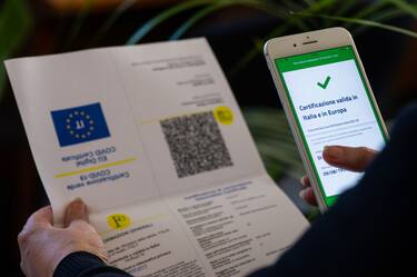 A worker checking green pass certificate in L'Aquila, Italy, on October 15, 2021. On October 15 green card certification becomes mandatory for all workers. (Photo by Lorenzo Di Cola/NurPhoto via Getty Images)