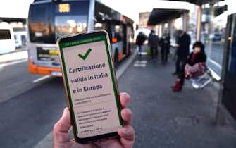 Valid Green Pass for Italy and EU nation after check the QR code confirming that people received the Covid-19 vaccine, at Brignole bus stop in Genoa, Italy, 06 December 2021. The measures on the 'enhanced' green certificate (obtainable only with vaccination or recovery) come into effect from 06 December 2021 until 15 January 2022ANSA/LUCA ZENNARO