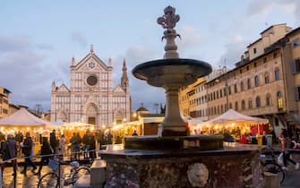 The Christmas market in Santa Croce square, Florence, Tuscany, Italy, Europe. (Photo by: Stefano Cellai/REDA&CO/Universal Images Group via Getty Images)