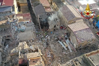 epa09637932 A handout picture provided by the Vigili del Fuoco shows an aerial view of the damage following a blast caused by a gas leak in Ravanusa, Sicily, Italy, 12 December 2021. Firefighters found a fourth body in the rubble of the collapsed buildings; two survivors were rescued, five people are still missing.  EPA/VIGILI DEL FUOCO HANDOUT  HANDOUT EDITORIAL USE ONLY/NO SALES