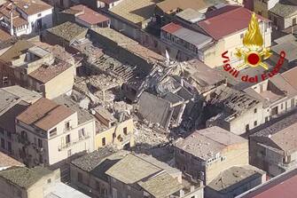 epa09637903 A handout picture provided by the Vigili del Fuoco shows an aerial view after blast caused by a gas leaklater in Ravanusa, Sicily, Italy, 12 December 2021. Firefighters found a fourth body in the rubble of the collapsed buildings in Ravanusa. It could be a woman. Previously, the bodies of two women and a man were recovered; two survivors rescued, five people are still missing.  EPA/VIGILI DEL FUOCO HANDOUT BEST QUALITY AVAILABLE HANDOUT EDITORIAL USE ONLY/NO SALES